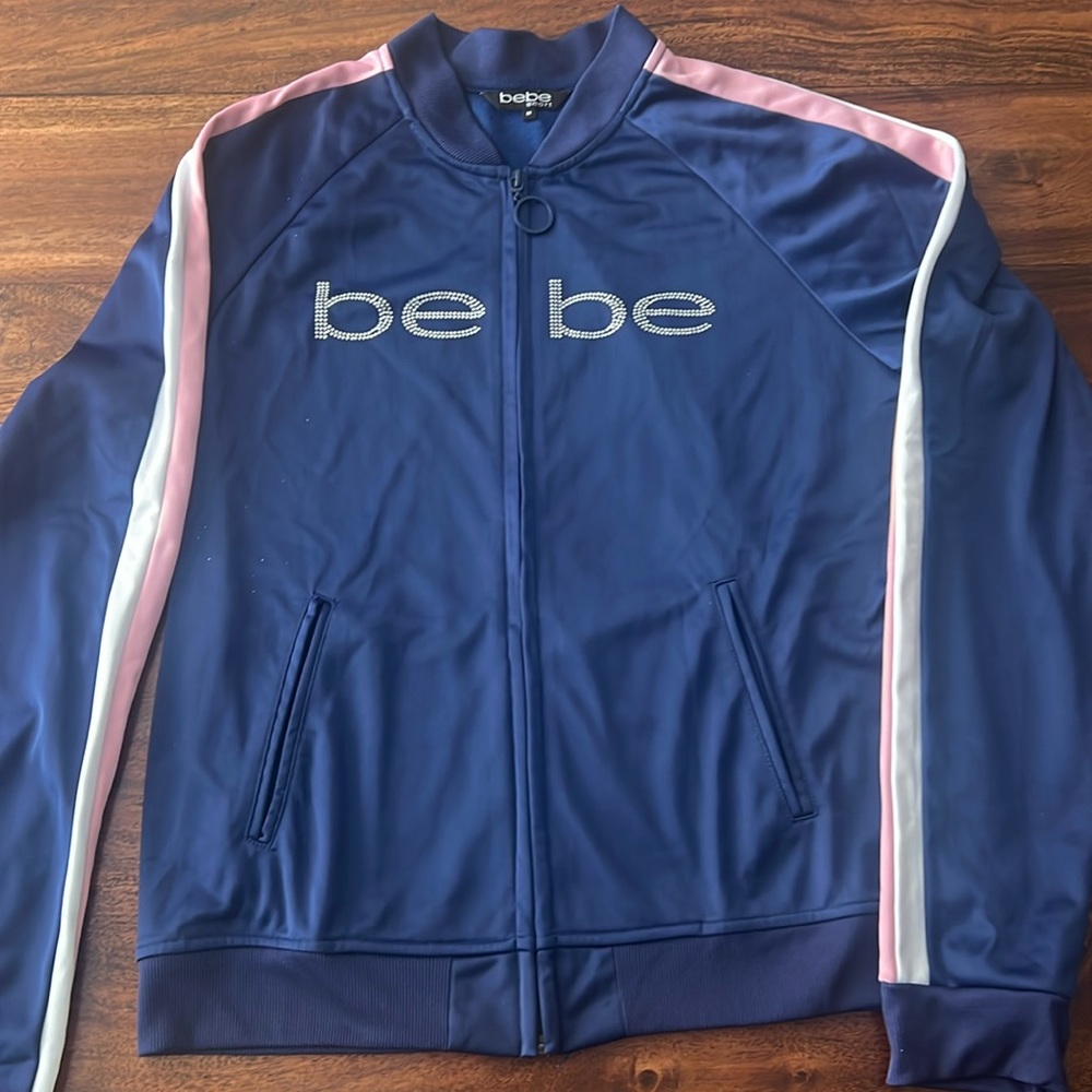 BEBE blue jacket with pink/white tripe on sleeves.Size M.Elegant, unique, Comfy.